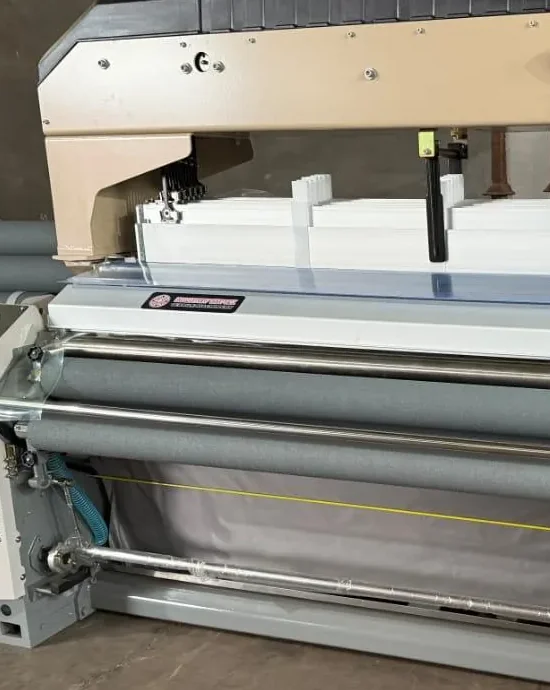 Cloth beam, guides and warp sheet on a new loom